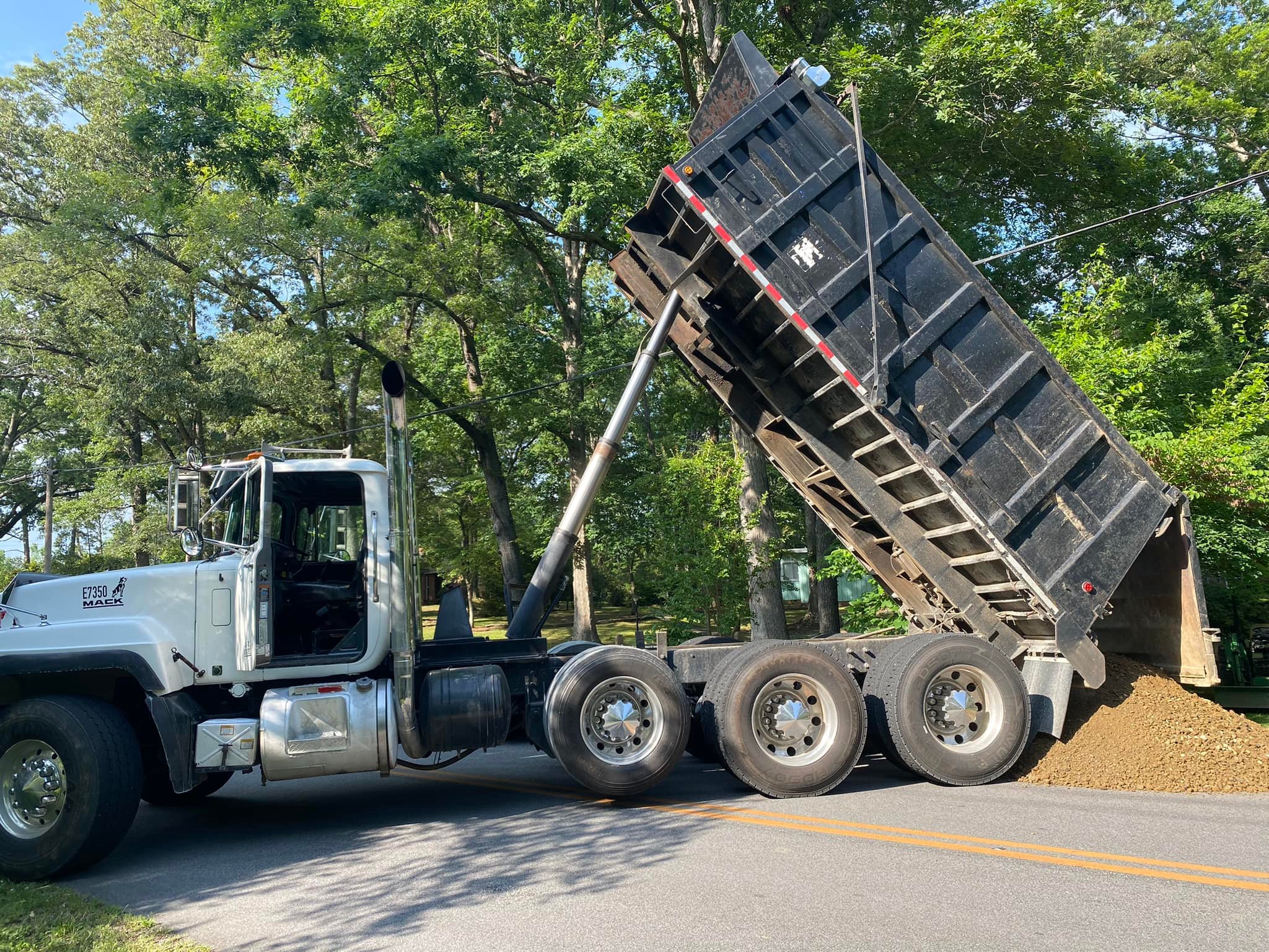 Dump Truck and Michael Anderson, Owner of Trinity Land Services