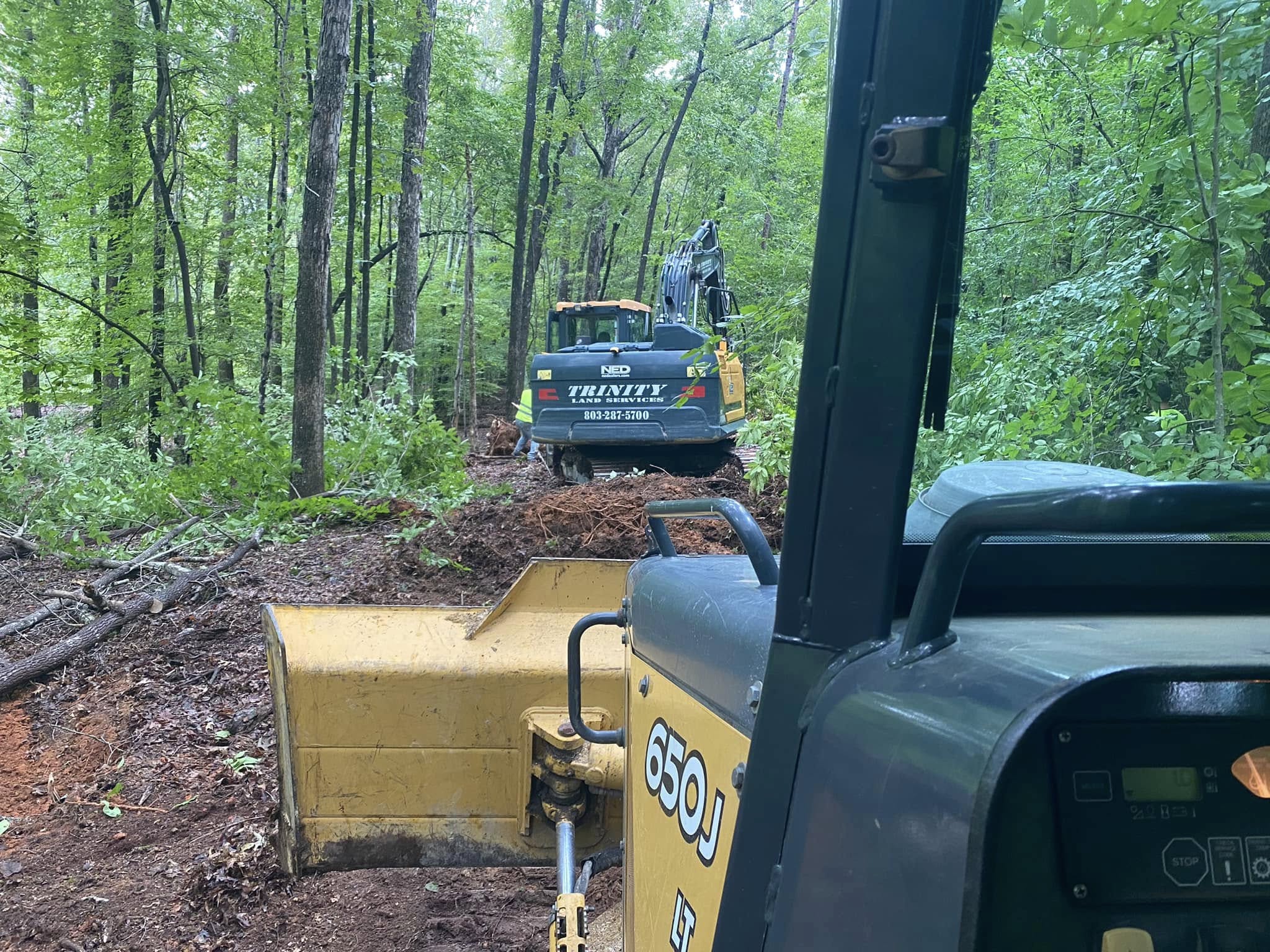 Dump Truck and Michael Anderson, Owner of Trinity Land Services